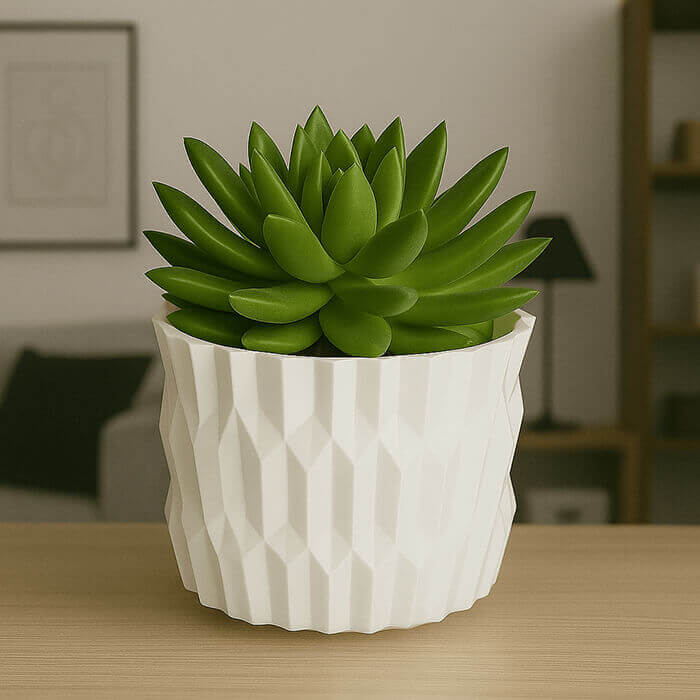 Modern white diamond-pattern 3D printed PLA planter with green succulent on wooden table indoors.