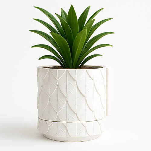 White leaf-textured 3D printed PLA wall-mounted planter with green indoor plant.