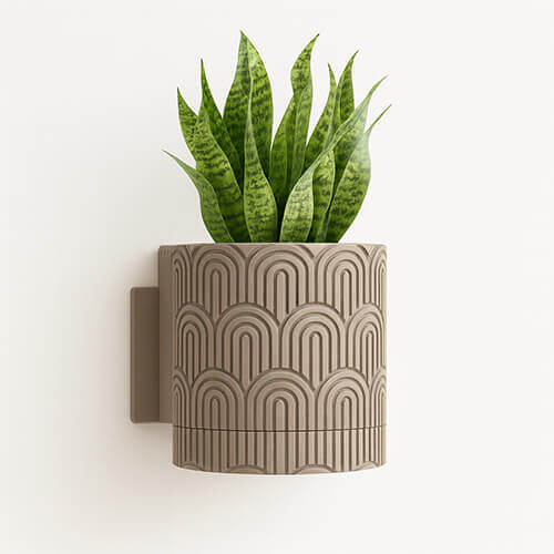 Brown arc-pattern 3D printed PLA wall-mounted planter with snake plant.