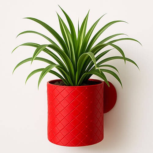 Red basket-weave textured 3D printed PLA wall-mounted planter with green indoor plant.