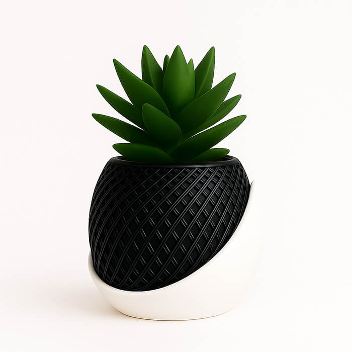 Black and white modern wrap 3D printed PLA planter with woven textured pattern, holding green succulent, minimalist contemporary design by Plantale.