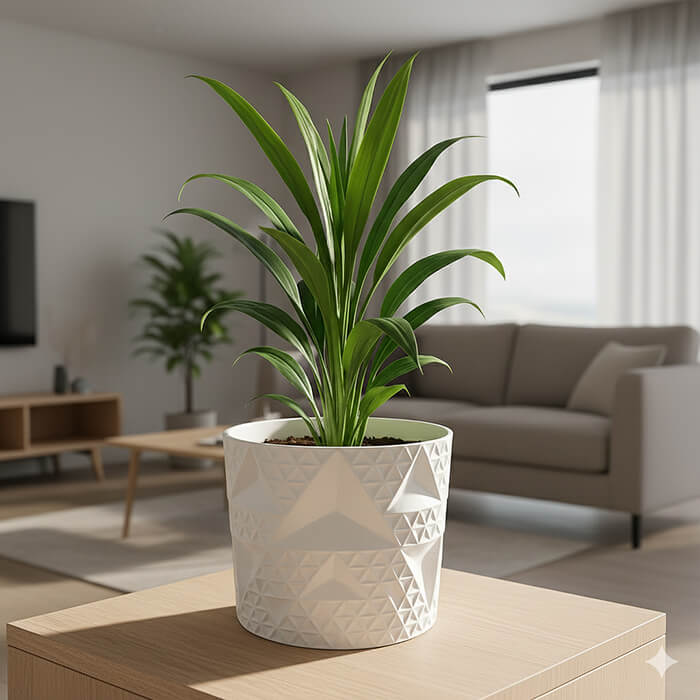 Modern white geometric diamond-pattern 3D printed PLA planter with green indoor plant in a living room.