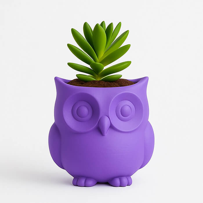 Purple owl-shaped 3D printed PLA planter with minimalist owl details, holding small green succulent, cute modern decor by Plantale.