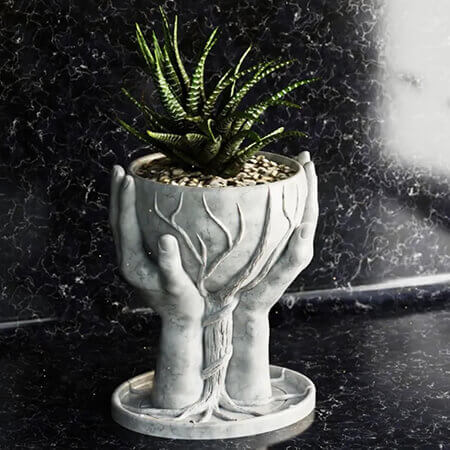 White hands holding tree 3D printed PLA planter featuring a green succulent plant, symbolic tree design growing from sculpted hands, by Plantale.